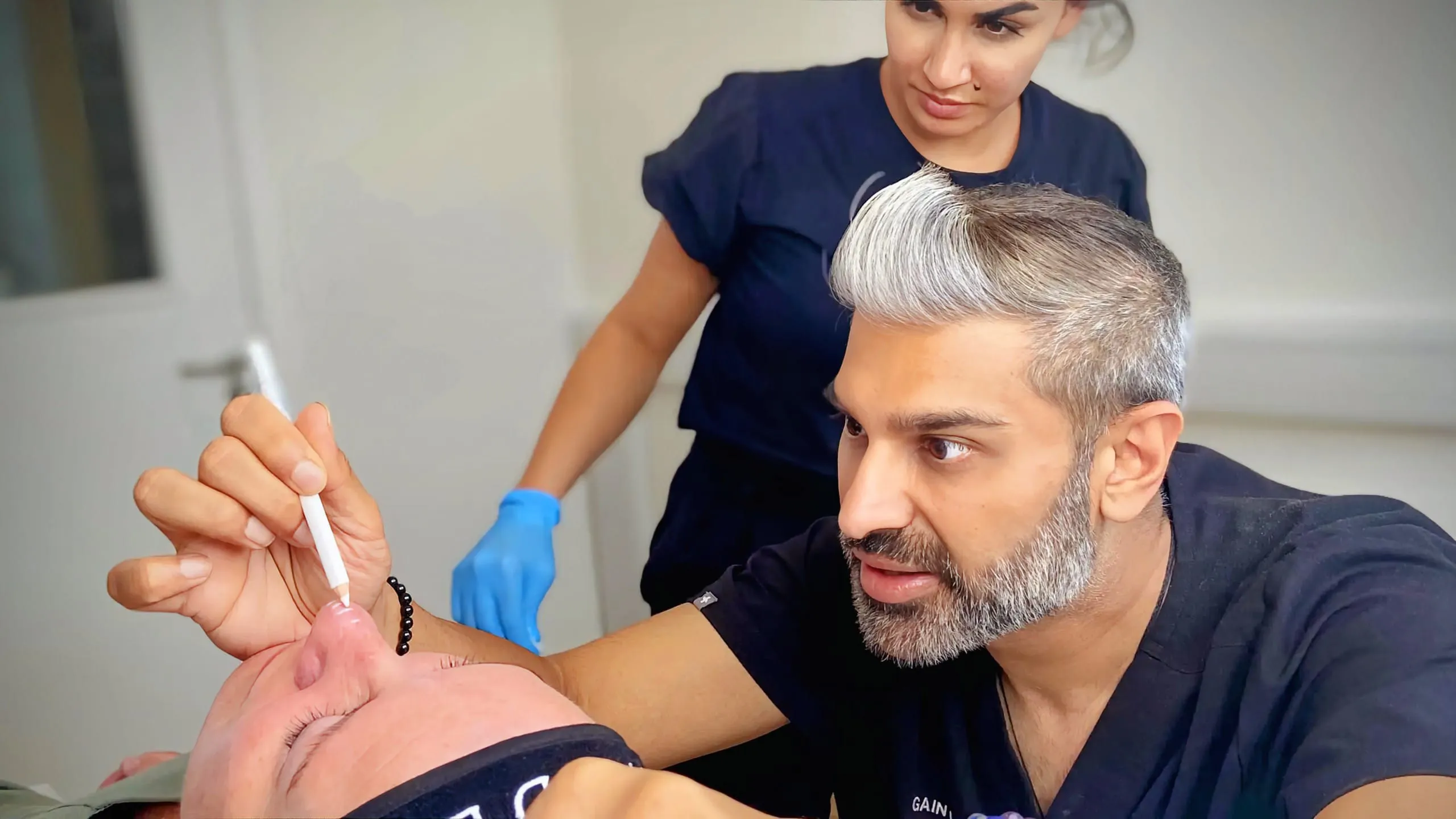 Medical aesthetics training - delegate practicing non-surgical rhinoplasty injection under supervision of Dr Rikin Parekh